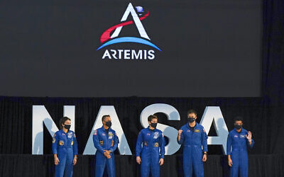 Five of the astronauts that will be part of the Atremis missions, from left, Jessica Meir, Joe Acaba, Anne McClain, Matthew Dominick, and Jessica Watkins are introduced by Vice President Mike Pence during the eighth meeting of the National Space Council at the Kennedy Space Center Wednesday, Dec. 9, 2020, in Cape Canaveral , Fla. (AP Photo/John Raoux)