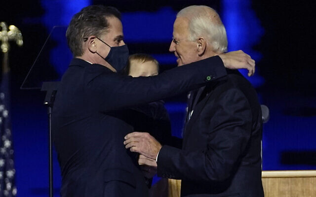 In this file photo, President-elect Joe Biden, right, embraces his son Hunter Biden, left, in Wilmington, Delaware, November 7, 2020. (AP/Andrew Harnik, Pool) In this file photo, President-elect Joe Biden, right, embraces his son Hunter Biden, left, in Wilmington, Delaware, November 7, 2020. (AP/Andrew Harnik, Pool)