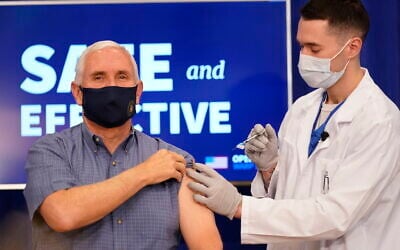 US Vice President Mike Pence receives a Pfizer-BioNTech COVID-19 vaccine shot at the Eisenhower Executive Office Building on the White House complex on December 18, 2020, in Washington.   (AP/Andrew Harnik)