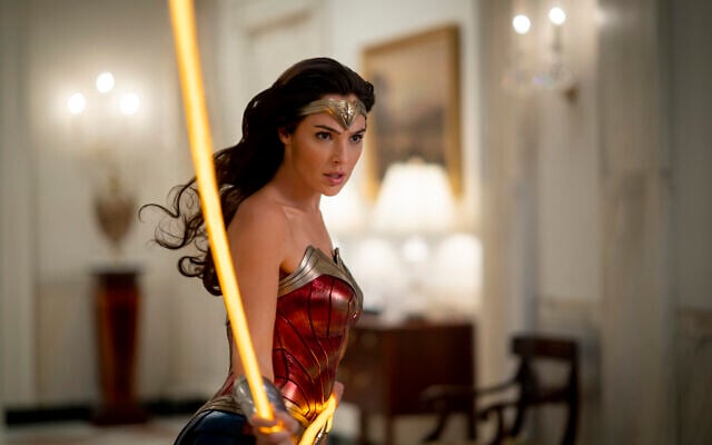 This image released by Warner Bros. Entertainment shows Gal Gadot in a scene from 'Wonder Woman 1984.' (Clay Enos/Warner Bros. via AP) This image released by Warner Bros. Entertainment shows Gal Gadot in a scene from 'Wonder Woman 1984.' (Clay Enos/Warner Bros. via AP)