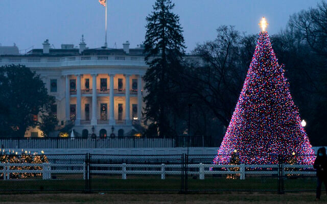 The National Christmas Tree glows with lights on the Ellipse near the White House, Thursday, Dec. 24, 2020, on Christmas Eve in Washington. (AP/Jacquelyn Martin) The National Christmas Tree glows with lights on the Ellipse near the White House, Thursday, Dec. 24, 2020, on Christmas Eve in Washington. (AP/Jacquelyn Martin)