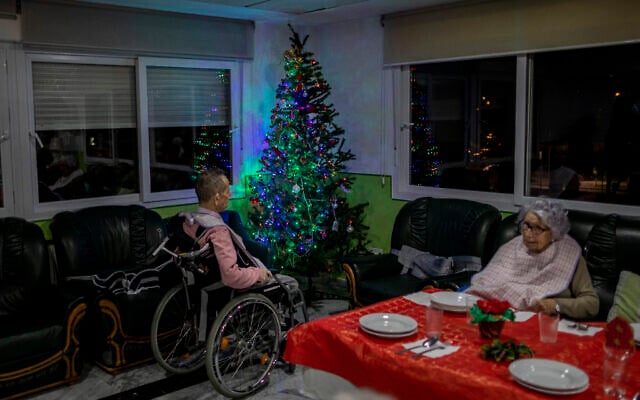 Two elderly people wait for Christmas eve dinner at an elderly care home in Pozuelo de Alarcon, outskirts of Madrid on Dec. 24, 2020. Many of the elderly in the residence haven't celebrated Christmas eve with their relatives to prevent the spread of coronavirus (AP/Bernat Armangue) Two elderly people wait for Christmas eve dinner at an elderly care home in Pozuelo de Alarcon, outskirts of Madrid on Dec. 24, 2020. Many of the elderly in the residence haven't celebrated Christmas eve with their relatives to prevent the spread of coronavirus (AP/Bernat Armangue)