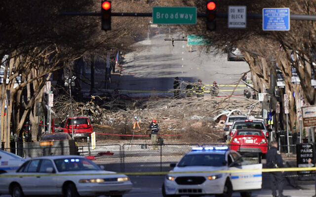 Investigators continue to examine the site of an explosion, December 27, 2020, in downtown Nashville, Tennessee. (AP Photo/Mark Humphrey) Investigators continue to examine the site of an explosion, December 27, 2020, in downtown Nashville, Tennessee. (AP Photo/Mark Humphrey)