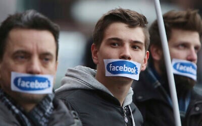 Illustrative: People protest in front of the Facebook office in Warsaw, Poland, Saturday, Nov. 5, 2016. (AP/Czarek Sokolowski)