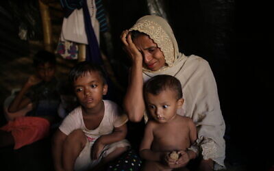 Jamila Begum, 35, cries when talking about how members of Myanmar's armed forces accused of massacring civilians in her village Maung Nu, in Myanmar's Rakhine State, killed her son and husband, in an interview with The Associated Press in Kutupalong refugee camp in Bangladesh, November 26, 2017. (AP Photo/Wong Maye-E)