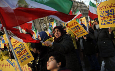 Illustrative -- Demonstrators of Iranian opposition group PMOI (People's Mujahedin Organization) protest near the Iran's embassy in Paris, Jan. 3, 2018, in solidarity with those demonstrating in Iran (AP Photo/Christophe Ena)