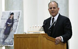 Elan Carr, the United States Special Envoy for Monitoring and Combating anti-Semitism, speaks April 29, 2019, next to a photo of Lori Kaye, who was killed when a gunman opened fire inside the Chabad of Poway synagogue, during a memorial service for Kaye in Poway, California. (AP Photo/Gregory Bull)