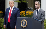 Illustrative: US President Donald Trump listens as Adam Boehler, CEO of US International Development Finance Corporation, speaks about the coronavirus in the Rose Garden of the White House, April 14, 2020, in Washington. (AP Photo/Alex Brandon/File)