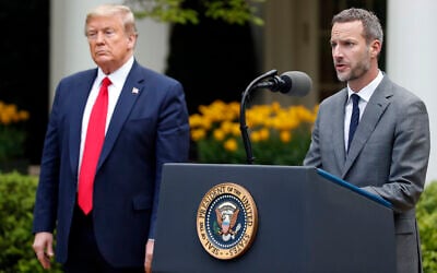 Illustrative: US President Donald Trump listens as Adam Boehler, CEO of US International Development Finance Corporation, speaks about the coronavirus in the Rose Garden of the White House, April 14, 2020, in Washington. (AP Photo/Alex Brandon/File)