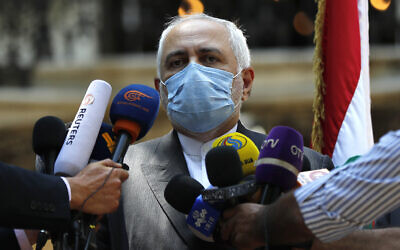 Iranian Foreign Minister Mohammad Javad Zarif speaks outside the Lebanese Foreign Ministry, August 14, 2020. (AP Photo/Hussein Malla)