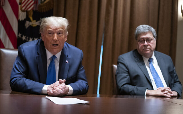 Then-US Attorney General William Barr listens as then-US president Donald Trump speaks during a meeting with Republican state attorneys general in the Cabinet Room of the White House in Washington, September 23, 2020. (AP Photo/Evan Vucci, File) Then-US Attorney General William Barr listens as then-US president Donald Trump speaks during a meeting with Republican state attorneys general in the Cabinet Room of the White House in Washington, September 23, 2020. (AP Photo/Evan Vucci, File)