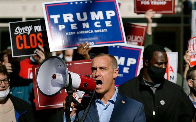 US President Donald Trump's campaign advisor Corey Lewandowski, center, speaks about a court order obtained to grant more access to vote counting operations at the Pennsylvania Convention Center, Thursday, Nov. 5, 2020, in Philadelphia, following Tuesday's election. (AP Photo/Matt Slocum) US President Donald Trump's campaign advisor Corey Lewandowski, center, speaks about a court order obtained to grant more access to vote counting operations at the Pennsylvania Convention Center, Thursday, Nov. 5, 2020, in Philadelphia, following Tuesday's election. (AP Photo/Matt Slocum)