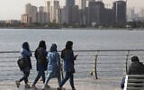 People spend their weekend on the shore of Persian Gulf Martyrs' Lake, in western Tehran, Iran, November 5, 2020. (Vahid Salemi/AP)