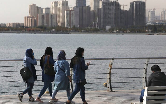 People spend their weekend on the shore of Persian Gulf Martyrs' Lake, in western Tehran, Iran, November 5, 2020. (Vahid Salemi/AP) People spend their weekend on the shore of Persian Gulf Martyrs' Lake, in western Tehran, Iran, November 5, 2020. (Vahid Salemi/AP)