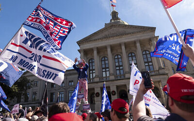Supporters of US President Donald Trump rally outside of the Georgia State Capitol in Atlanta on November 21, 2020. (AP/Ben Gray)