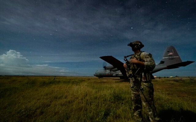 A junior sniper, assigned to the 1-186th Infantry Battalion, Task Force Guardian, Combined Joint Task Force - Horn of Africa, provides security for a 75th Expeditionary Airlift Squadron (EAS) C-130J Super Hercules during unloading operations at an unidentified location in Somalia June 28, 2020 (Tech. Sgt. Christopher Ruano/Combined Joint Task Force - Horn of Africa via AP) A junior sniper, assigned to the 1-186th Infantry Battalion, Task Force Guardian, Combined Joint Task Force - Horn of Africa, provides security for a 75th Expeditionary Airlift Squadron (EAS) C-130J Super Hercules during unloading operations at an unidentified location in Somalia June 28, 2020 (Tech. Sgt. Christopher Ruano/Combined Joint Task Force - Horn of Africa via AP)