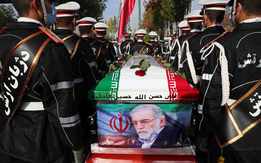 Military personnel stand near the flag-draped coffin of Mohsen Fakhrizadeh, an assassinated top nuclear scientist, during his funeral ceremony in Tehran, Iran, November 30, 2020. (Iranian Defense Ministry via AP) Military personnel stand near the flag-draped coffin of Mohsen Fakhrizadeh, an assassinated top nuclear scientist, during his funeral ceremony in Tehran, Iran, November 30, 2020. (Iranian Defense Ministry via AP)