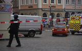 A square is blocked by the police in Trier, Germany, Tuesday, Dec. 1, 2020 after a suspected vehicular homicide. (Harald Tittel/dpa via AP)
