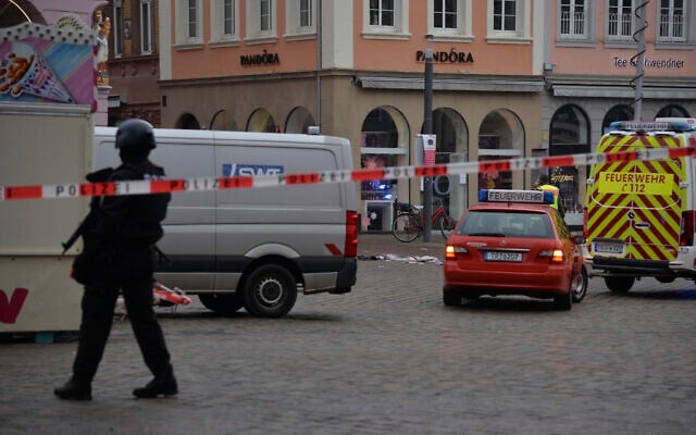 A square is blocked by the police in Trier, Germany, Tuesday, Dec. 1, 2020 after a suspected vehicular homicide. (Harald Tittel/dpa via AP) A square is blocked by the police in Trier, Germany, Tuesday, Dec. 1, 2020 after a suspected vehicular homicide. (Harald Tittel/dpa via AP)