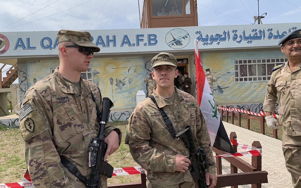 In this March 27, 2020 photo, US soldiers stand guard during the hand over ceremony of Qayyarah Airfield, Iraqi Security Forces, in the south of Mosul, Iraq. (AP Photo/Ali Abdul Hassan, File) In this March 27, 2020 photo, US soldiers stand guard during the hand over ceremony of Qayyarah Airfield, Iraqi Security Forces, in the south of Mosul, Iraq. (AP Photo/Ali Abdul Hassan, File)