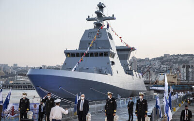 President Reuven Rivlin, center, and Israel Defense Forces Chief of Staff Aviv Kohavi attend a ceremony celebrating the arrival of the first of four new Sa'ar 6 ships in Haifa, on December 2, 2020. (Heidi Levine/Pool Photo via AP)