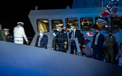 President Reuven  Rivlin and IDF Chief of Staff Aviv Kohavi attend a ceremony on the deck of the first of four new Sa'ar 6 ships in Haifa, on December 2, 2020. (Heidi Levine/Pool Photo via AP)