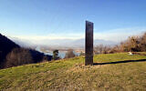 In this Nov. 27, 2020, file photo, a metal structure sticks out from the ground on the Batca Doamnei hill, outside Piatra Neamt, northern Romania (Robert Iosub/ziarpiatraneamt.ro via AP, File)