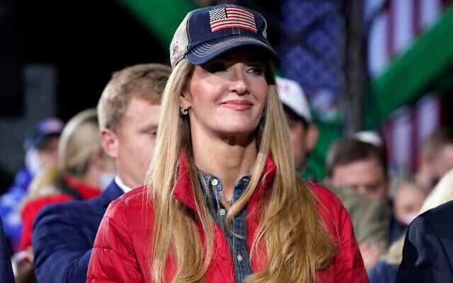 Sen. Kelly Loeffler, R-Ga., listens as US President Donald Trump speaks during a campaign rally for Senate Republican candidates, at Valdosta Regional Airport, Saturday, Dec. 5, 2020, in Valdosta, Ga. (AP Photo/Evan Vucci) Sen. Kelly Loeffler, R-Ga., listens as US President Donald Trump speaks during a campaign rally for Senate Republican candidates, at Valdosta Regional Airport, Saturday, Dec. 5, 2020, in Valdosta, Ga. (AP Photo/Evan Vucci)