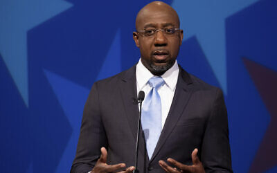 Democratic challenger for U.S. Senate Raphael Warnock speaks during a debate with Republican U.S. Sen. Kelly Loeffler on December 6, 2020, in Atlanta. (AP/Ben Gray, Pool) Democratic challenger for U.S. Senate Raphael Warnock speaks during a debate with Republican U.S. Sen. Kelly Loeffler on December 6, 2020, in Atlanta. (AP/Ben Gray, Pool)