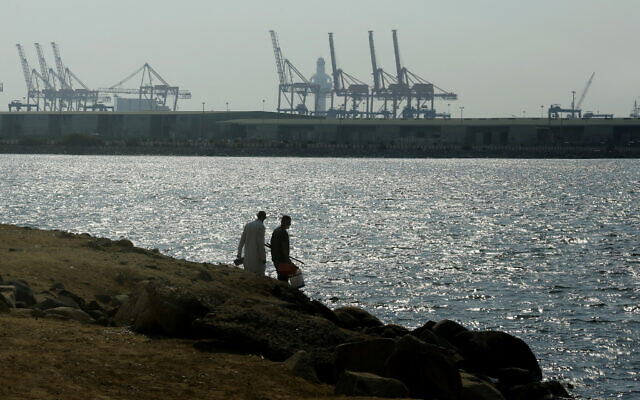 ILLUSTRATIVE -- Visitors prepare to fish in front of the Red Sea port, in Jiddah, Saudi Arabia, Dec.14, 2020 (AP Photo/Amr Nabil) ILLUSTRATIVE -- Visitors prepare to fish in front of the Red Sea port, in Jiddah, Saudi Arabia, Dec.14, 2020 (AP Photo/Amr Nabil)