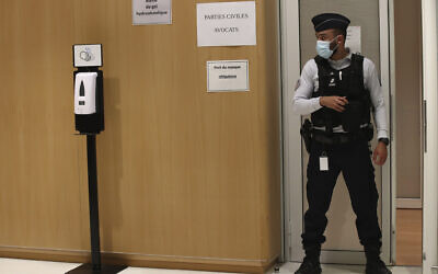 Illustrative -- A police officer guards the courtroom at the Paris Hall of Justice, Dec. 16, 2020 in Paris (AP Photo/Michel Euler)