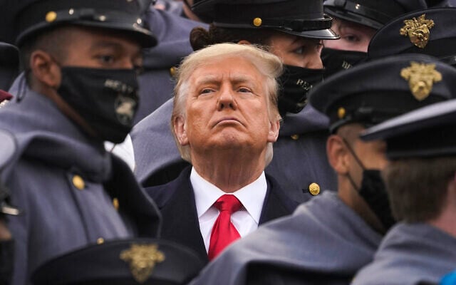 Surrounded by Army cadets, President Donald Trump watches the first half of the 121st Army-Navy Football Game in Michie Stadium at the United States Military Academy, Saturday, Dec. 12, 2020, in West Point, N.Y. (AP Photo/Andrew Harnik) Surrounded by Army cadets, President Donald Trump watches the first half of the 121st Army-Navy Football Game in Michie Stadium at the United States Military Academy, Saturday, Dec. 12, 2020, in West Point, N.Y. (AP Photo/Andrew Harnik)