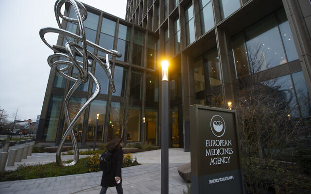 A person enters the European Medicines Agency in Amsterdam, Netherlands, Dec. 21, 2020, where the EMA's human medicines committee is holding an exceptional, fully virtual, meeting to conclude the evaluation of the Pfizer-BioNTech COVID-19 vaccine. (AP Photo/Peter Dejong) A person enters the European Medicines Agency in Amsterdam, Netherlands, Dec. 21, 2020, where the EMA's human medicines committee is holding an exceptional, fully virtual, meeting to conclude the evaluation of the Pfizer-BioNTech COVID-19 vaccine. (AP Photo/Peter Dejong)
