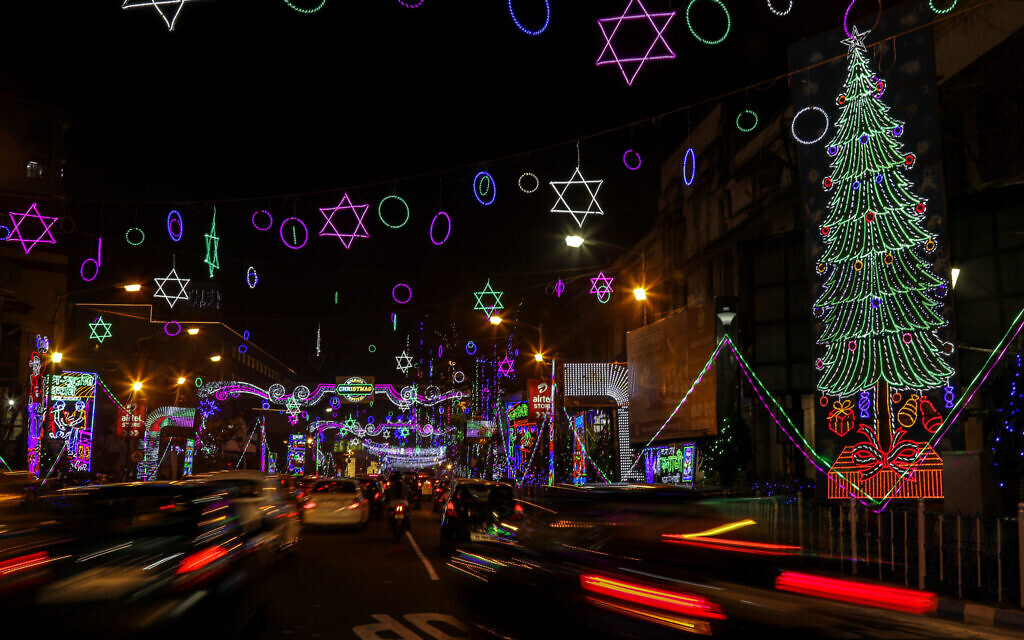 Traffic moves on a street decorated ahead of Christmas in Kolkata, India, December 22, 2020. Though Hindus and Muslims comprise a majority of the population in India, Christmas is a national holiday celebrated with much fanfare. (AP Photo/Bikas Das)