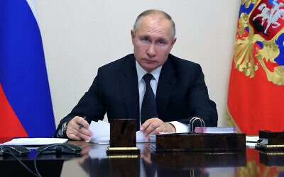 Russian President Vladimir Putin attends a meeting via video conference in Moscow, Russia, December 23, 2020. (Mikhail Klimentyev, Sputnik, Kremlin Pool Photo via AP)