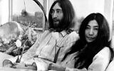 Beatle John Lennon and his wife, Yoko Ono, hold a bed-in for peace in room 902, the presidential suite at the Hilton Hotel in Amsterdam, on March 25, 1969. (AP Photo)