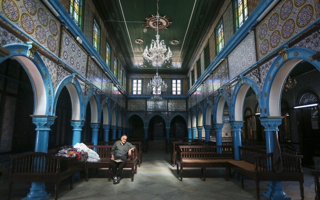 A Jewish Tunisian rests inside the Ghriba synagogue, one the oldest Jewish monuments built in Africa more than 2,500 years ago, on the resort island of Djerba, south of Tunis, Tunisia, Wednesday, Oct. 28, 2015. (AP Photo/Mosa'ab Elshamy) A Jewish Tunisian rests inside the Ghriba synagogue, one the oldest Jewish monuments built in Africa more than 2,500 years ago, on the resort island of Djerba, south of Tunis, Tunisia, Wednesday, Oct. 28, 2015. (AP Photo/Mosa'ab Elshamy)