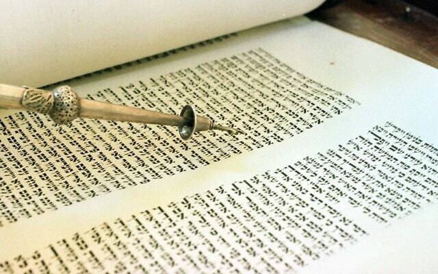 Illustrative: A pointer is used to follow the Hebrew written passages in the Torah. (AP Photo/ Rogelio Solis) Illustrative: A pointer is used to follow the Hebrew written passages in the Torah. (AP Photo/ Rogelio Solis)