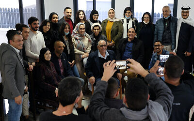 Participants of a delegation from Bahrain and the United Arab Emirates pose for a photograph with residents of the Bedouin town of Zarzir during a visit to Israel on December 16, 2020. (Judah Ari Gross/Times of Israel)