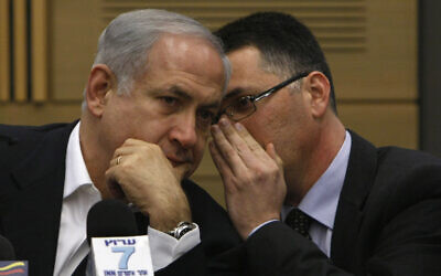 Prime Minister Benjamin Netanyahu speaks with Gideon Sa'ar at a Likud party meeting in the Knesset, March 2, 2009. (Miriam Alster / FLASH90)