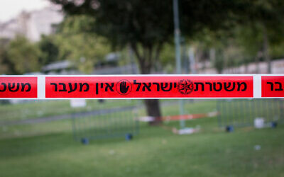 Illustrative -- Police tape hangs in Jerusalem. (Garrett Mills/Flash90)