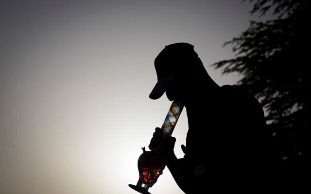 Illustrative: A young Israeli smokes marijuana in Jerusalem, on April 20, 2017. (Yonatan Sindel/Flash90) Illustrative: A young Israeli smokes marijuana in Jerusalem, on April 20, 2017. (Yonatan Sindel/Flash90)