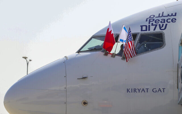 Illustrative: The national flags of Bahrain, Israel and America are seen on an El Al plane to Bahrain flying a delegation to sign a series of bilateral agreements between Jerusalem and Manama, at Ben Gurion airport in Lod, near Tel Aviv, Israel Sunday, Oct. 18, 2020. (Marc Israel Sellem/POOL) Illustrative: The national flags of Bahrain, Israel and America are seen on an El Al plane to Bahrain flying a delegation to sign a series of bilateral agreements between Jerusalem and Manama, at Ben Gurion airport in Lod, near Tel Aviv, Israel Sunday, Oct. 18, 2020. (Marc Israel Sellem/POOL)
