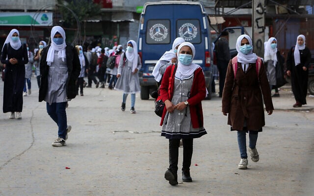 Palestinian students affiliated with UNRWA wear face masks amid the coronavirus pandemic, in Rafah, south of the Gaza Strip, on November 25, 2020. (Abed Rahim Khatib/Flash90) Palestinian students affiliated with UNRWA wear face masks amid the coronavirus pandemic, in Rafah, south of the Gaza Strip, on November 25, 2020. (Abed Rahim Khatib/Flash90)