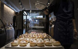 Sufganiyot on sale at Gagou de Paris bakery in downtown Jerusalem, ahead of the Jewish holiday of Hanukkah, on November 26, 2020. (Hadas Parush/Flash90)