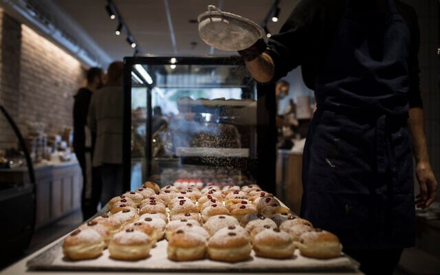 Sufganiyot on sale at Gagou de Paris bakery in downtown Jerusalem, ahead of the Jewish holiday of Hanukkah, on November 26, 2020. (Hadas Parush/Flash90) Sufganiyot on sale at Gagou de Paris bakery in downtown Jerusalem, ahead of the Jewish holiday of Hanukkah, on November 26, 2020. (Hadas Parush/Flash90)