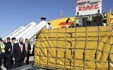 Prime Minister Benjamin Netanyahu and Health Minister Yuli Edelstein attend the arrival of the DHL freight plane transporting the first batch of Pfizer vaccines landing at Ben Gurion Airport on December 9 2020. (Marc Israel Sellem/ POOL)