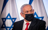 Israeli PM Benjamin Netanyahu at a joint press conference at the Ministry of Health in Jerusalem on December 9, 2020. (Yonatan Sindel/Flash90)
