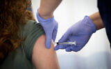 An Israeli nurse seen during a simulated vaccination against the COVID-19 virus, at the Sheba Medical Center near Tel Aviv. (Miriam Alster/Flash90)