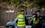 Police and medical personnel at scene where 2 kids were killed in a collision between a truck and a car on Road number 1, near Latrun on December 11 , 2020. (Yonatan Sindel/Flash90)